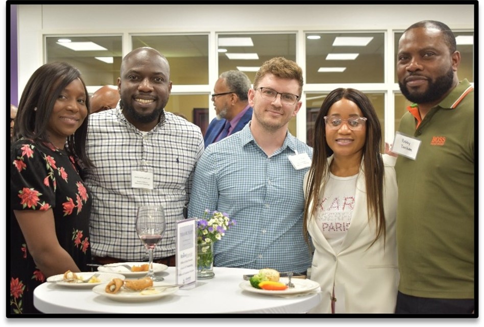Five graduates in the Center for Middle Georgia Studies enjoying reception
